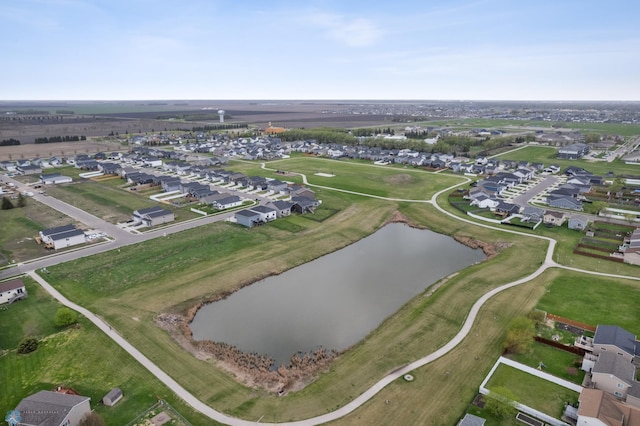 aerial overview of property's location with a nearby body of water and nearby suburban area