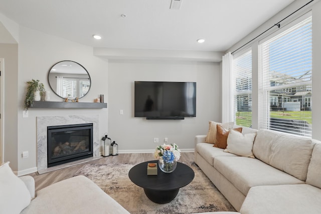 192 Junco Rd N, Lake Elmo, MN 55042 - living area featuring wood finished floors, a fireplace, baseboards, and recessed lighting