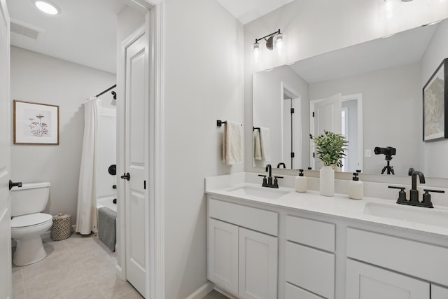 192 Junco Rd N, Lake Elmo, MN 55042 - bathroom with toilet, tile patterned floors, double vanity, shower / tub combo with curtain, and baseboards