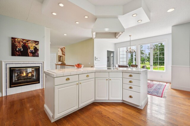 5225 Upland Ave, New Germany, MN 55367 - kitchen with tile countertops, light wood finished floors, white cabinets, and recessed lighting