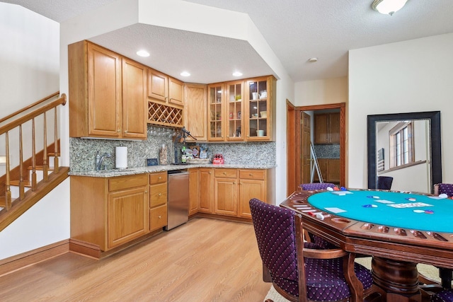 5225 Upland Ave, New Germany, MN 55367 - kitchen featuring stainless steel dishwasher, light wood finished floors, backsplash, a textured ceiling, and light stone countertops