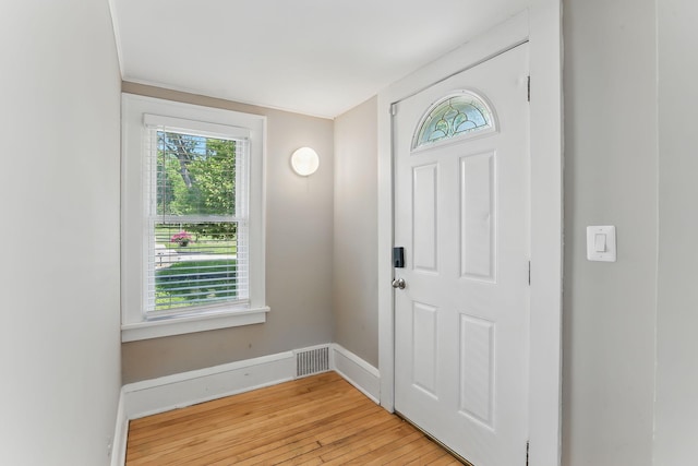 3519 Upton Ave N, Minneapolis, MN 55412 - foyer entrance with light wood-style floors and baseboards