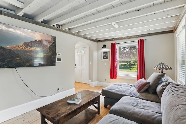 3519 Upton Ave N, Minneapolis, MN 55412 - living room with arched walkways, light wood finished floors, baseboards, and beamed ceiling