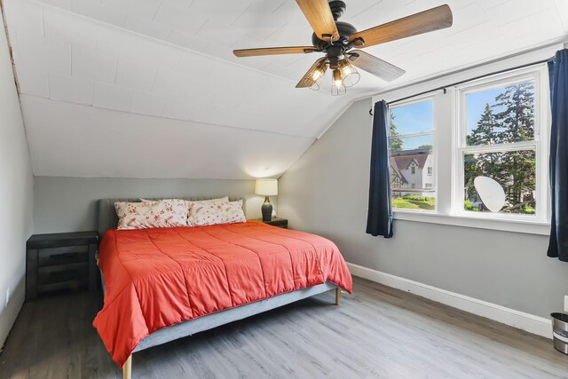 3519 Upton Ave N, Minneapolis, MN 55412 - bedroom featuring baseboards, wood finished floors, vaulted ceiling, and a ceiling fan