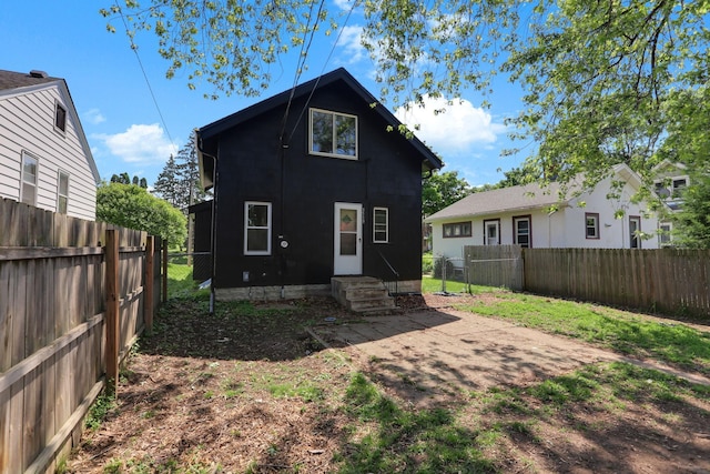 3519 Upton Ave N, Minneapolis, MN 55412 - back of house with a fenced backyard and entry steps