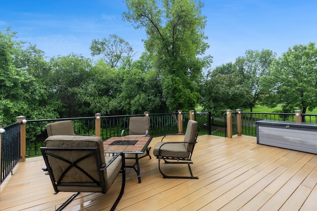 1376 Cobblestone Rd N, Champlin, MN 55316 - wooden deck with view of wooded area