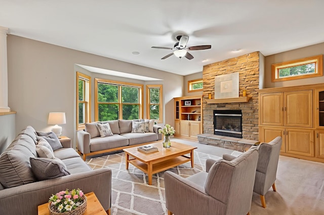 1376 Cobblestone Rd N, Champlin, MN 55316 - living area with a ceiling fan, a fireplace, and light carpet