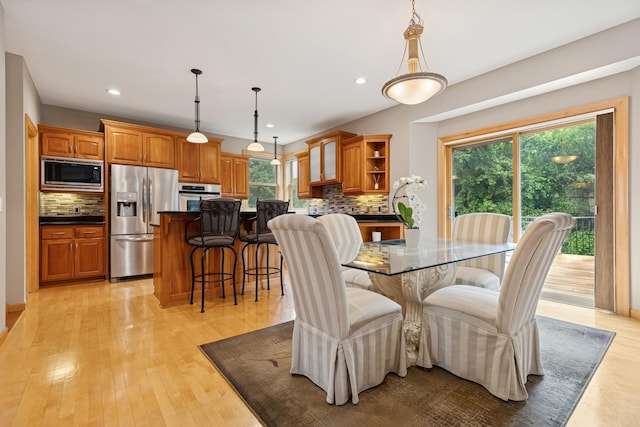 1376 Cobblestone Rd N, Champlin, MN 55316 - dining room with healthy amount of natural light, light wood-style flooring, and recessed lighting