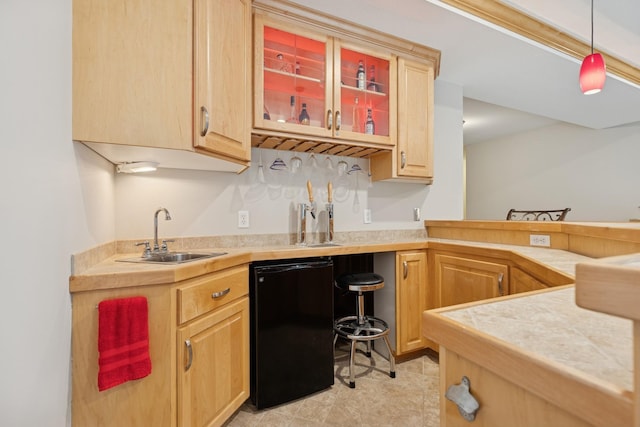 1376 Cobblestone Rd N, Champlin, MN 55316 - kitchen with light brown cabinetry, fridge, glass insert cabinets, and pendant lighting