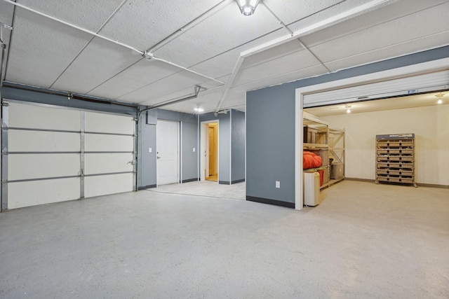 1376 Cobblestone Rd N, Champlin, MN 55316 - garage featuring baseboards
