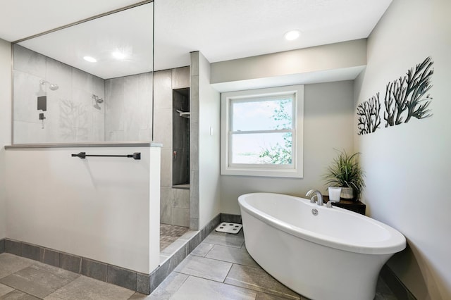 14590 Thicket Ln, Dayton, MN 55327 - bathroom with baseboards, a walk in shower, a soaking tub, and recessed lighting