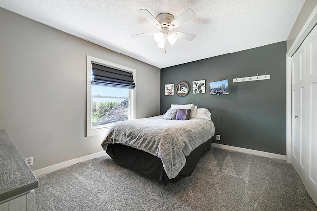 14590 Thicket Ln, Dayton, MN 55327 - bedroom with carpet, baseboards, a textured ceiling, ceiling fan, and a closet
