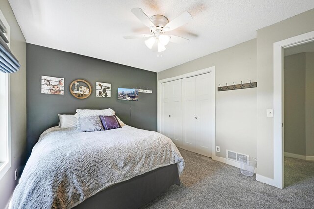 14590 Thicket Ln, Dayton, MN 55327 - carpeted bedroom featuring a closet, a ceiling fan, and baseboards