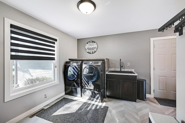14590 Thicket Ln, Dayton, MN 55327 - washroom featuring washer and clothes dryer, cabinet space, and baseboards