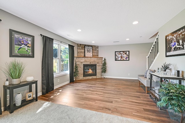 14590 Thicket Ln, Dayton, MN 55327 - living area featuring stairway, wood finished floors, baseboards, recessed lighting, and a fireplace