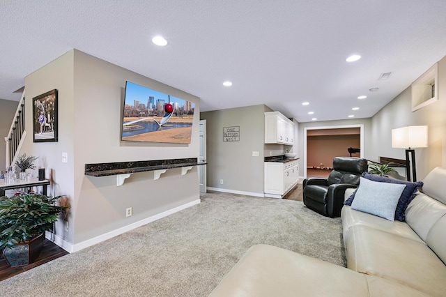 14590 Thicket Ln, Dayton, MN 55327 - living room with baseboards, recessed lighting, stairs, and light colored carpet