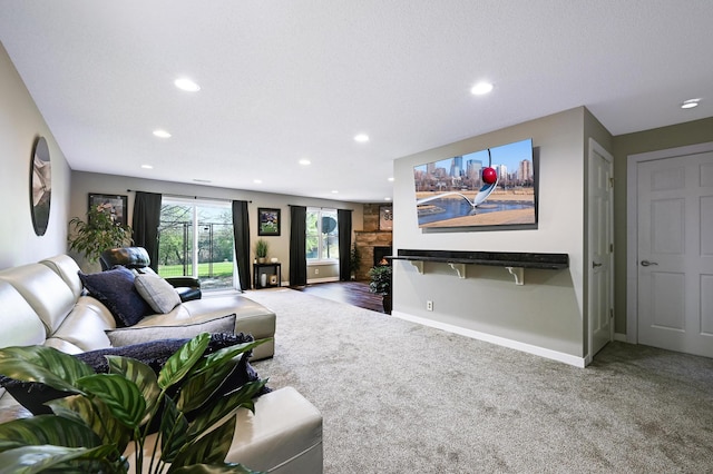 14590 Thicket Ln, Dayton, MN 55327 - living area featuring carpet, recessed lighting, baseboards, and a stone fireplace