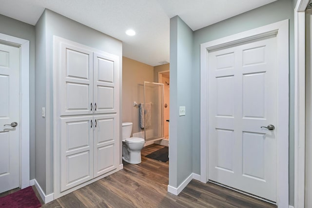 14590 Thicket Ln, Dayton, MN 55327 - full bathroom with toilet, wood finished floors, a shower stall, baseboards, and recessed lighting