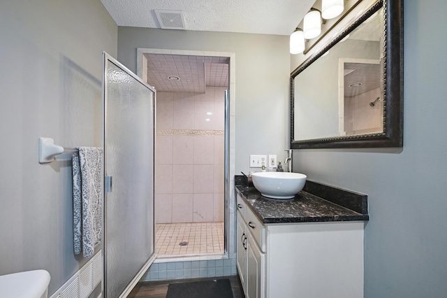 14590 Thicket Ln, Dayton, MN 55327 - full bathroom with a shower stall, vanity, and toilet