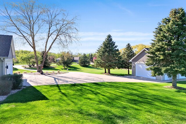14590 Thicket Ln, Dayton, MN 55327 - view of green lawn featuring a garage