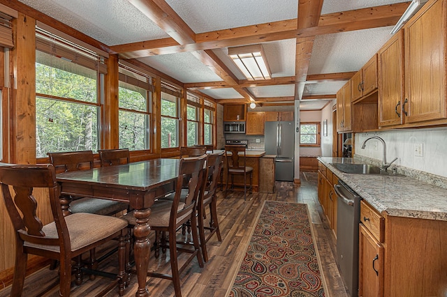 5305 Cisco Ln NE, Remer, MN 56672 - dining area with coffered ceiling, dark wood-type flooring, and beamed ceiling