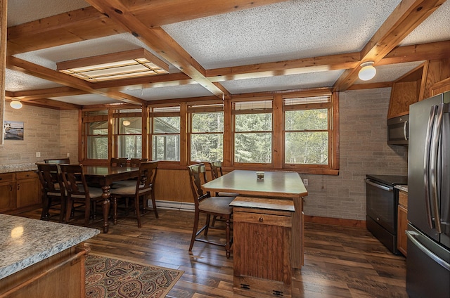5305 Cisco Ln NE, Remer, MN 56672 - dining area with coffered ceiling, dark wood-type flooring, beamed ceiling, brick wall, and baseboard heating