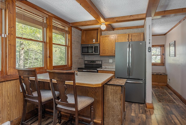 5305 Cisco Ln NE, Remer, MN 56672 - kitchen with stainless steel appliances, dark wood-style floors, healthy amount of natural light, backsplash, and a textured ceiling