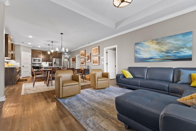 living room with dark wood-type flooring, recessed lighting, and ornamental molding