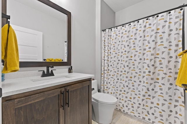 full bathroom featuring toilet, vanity, and a shower with shower curtain