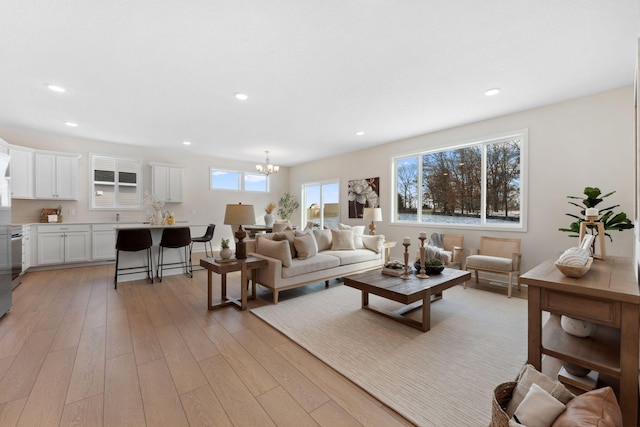7478 170th Ave NW, Ramsey, MN 55303 - living room featuring light wood-type flooring, a chandelier, and recessed lighting