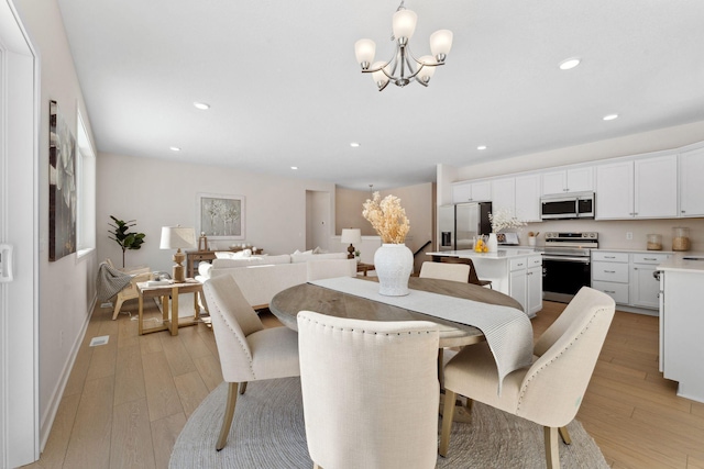 7478 170th Ave NW, Ramsey, MN 55303 - dining room featuring a chandelier, light wood-style flooring, recessed lighting, and baseboards
