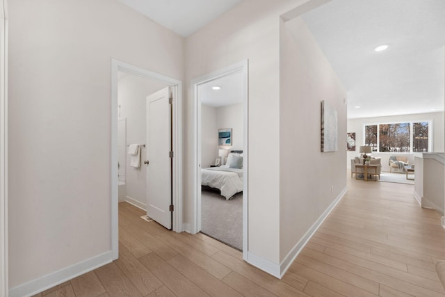 7478 170th Ave NW, Ramsey, MN 55303 - corridor featuring light wood finished floors, baseboards, and recessed lighting
