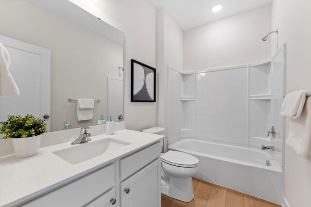 7478 170th Ave NW, Ramsey, MN 55303 - full bath featuring wood finished floors, shower / washtub combination, toilet, and vanity