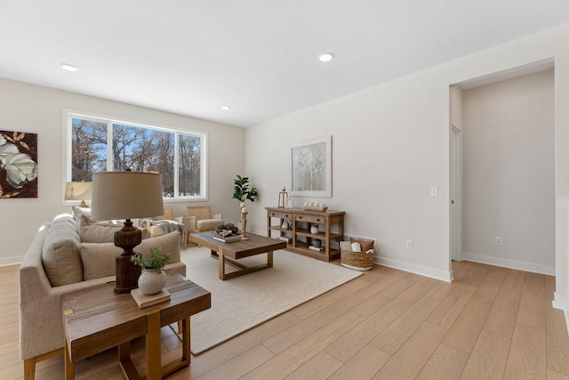 7478 170th Ave NW, Ramsey, MN 55303 - living room featuring light wood-style flooring, baseboards, and recessed lighting