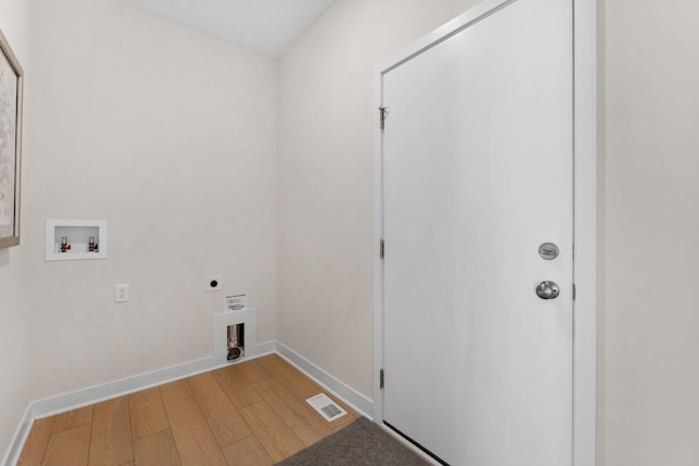 7478 170th Ave NW, Ramsey, MN 55303 - washroom featuring electric dryer hookup, hookup for a washing machine, light wood-style flooring, and baseboards