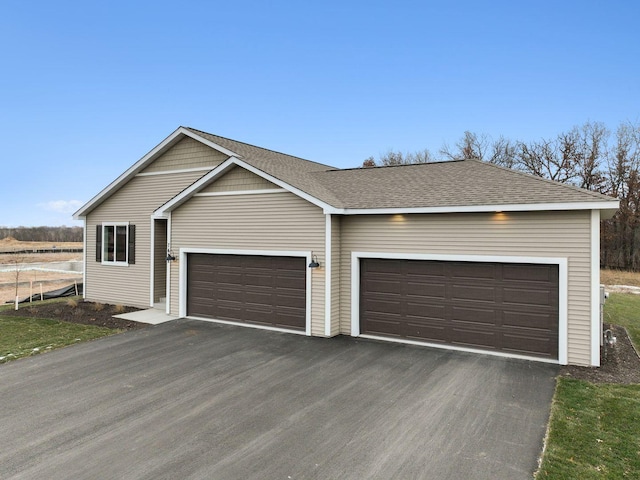 7478 170th Ave NW, Ramsey, MN 55303 - ranch-style house featuring driveway, roof with shingles, and an attached garage