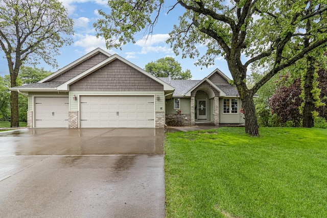 1270 145th Ave NW, Andover, MN 55304 - view of front of house featuring an attached garage, concrete driveway, a front yard, brick siding, and roof with shingles