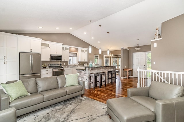 1270 145th Ave NW, Andover, MN 55304 - living room with wood finished floors, recessed lighting, and high vaulted ceiling