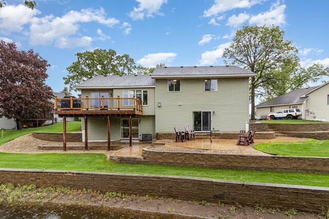 1270 145th Ave NW, Andover, MN 55304 - rear view of property with a patio area, a wooden deck, and a lawn