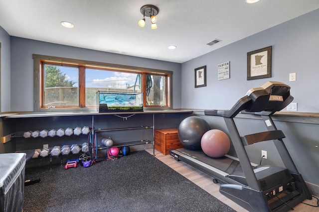 8132 Fillmore St NE, Spring Lake Park, MN 55432 - workout room featuring recessed lighting and wood finished floors