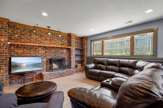 8132 Fillmore St NE, Spring Lake Park, MN 55432 - living area with a brick fireplace, wood finished floors, and recessed lighting