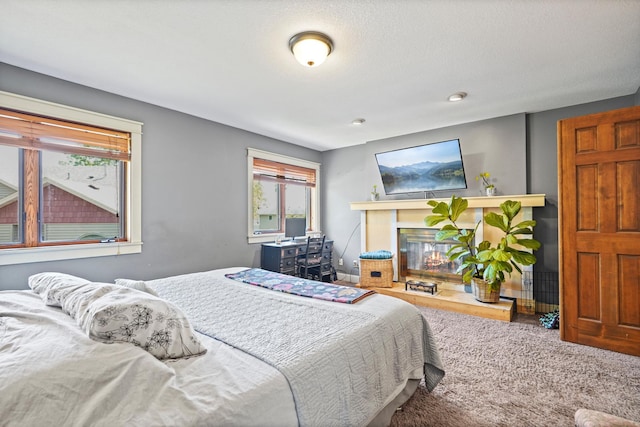 8132 Fillmore St NE, Spring Lake Park, MN 55432 - carpeted bedroom with a glass covered fireplace