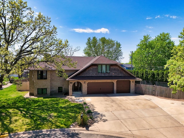 8132 Fillmore St NE, Spring Lake Park, MN 55432 - view of front of house with brick siding, concrete driveway, and an attached garage