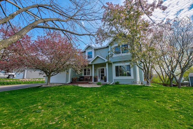 2167 Woodbridge Way, Woodbury, MN 55125 - traditional-style home featuring driveway, a front yard, an attached garage, and covered porch