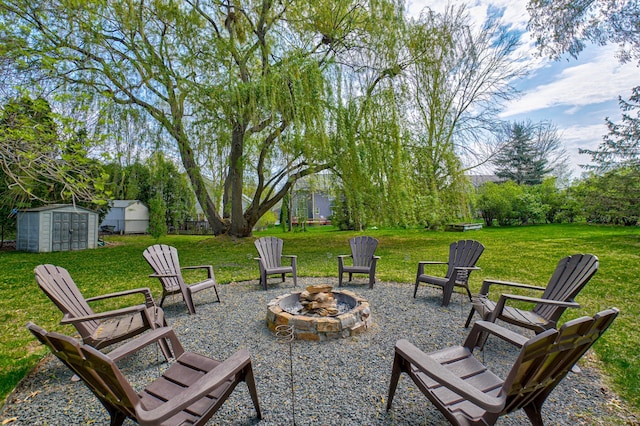2167 Woodbridge Way, Woodbury, MN 55125 - view of patio / terrace with an outdoor fire pit, a shed, and an outdoor structure