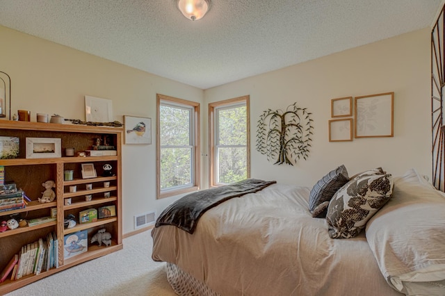 2167 Woodbridge Way, Woodbury, MN 55125 - bedroom with carpet floors and a textured ceiling