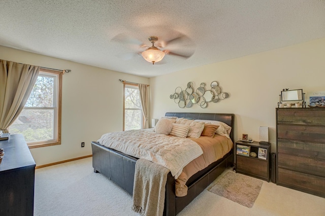 2167 Woodbridge Way, Woodbury, MN 55125 - bedroom with carpet flooring, baseboards, a textured ceiling, and ceiling fan