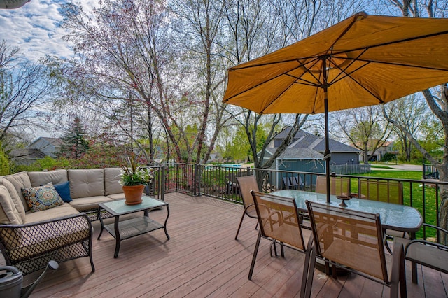 2167 Woodbridge Way, Woodbury, MN 55125 - wooden terrace with outdoor dining space, outdoor lounge area, and a lawn