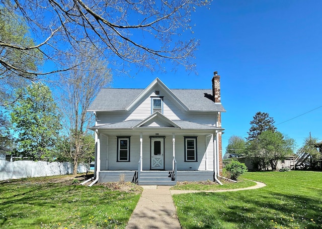 bungalow featuring a chimney and covered porch