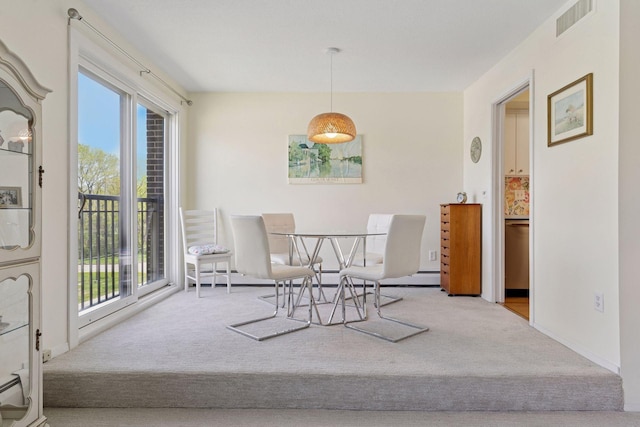 dining space featuring carpet floors
